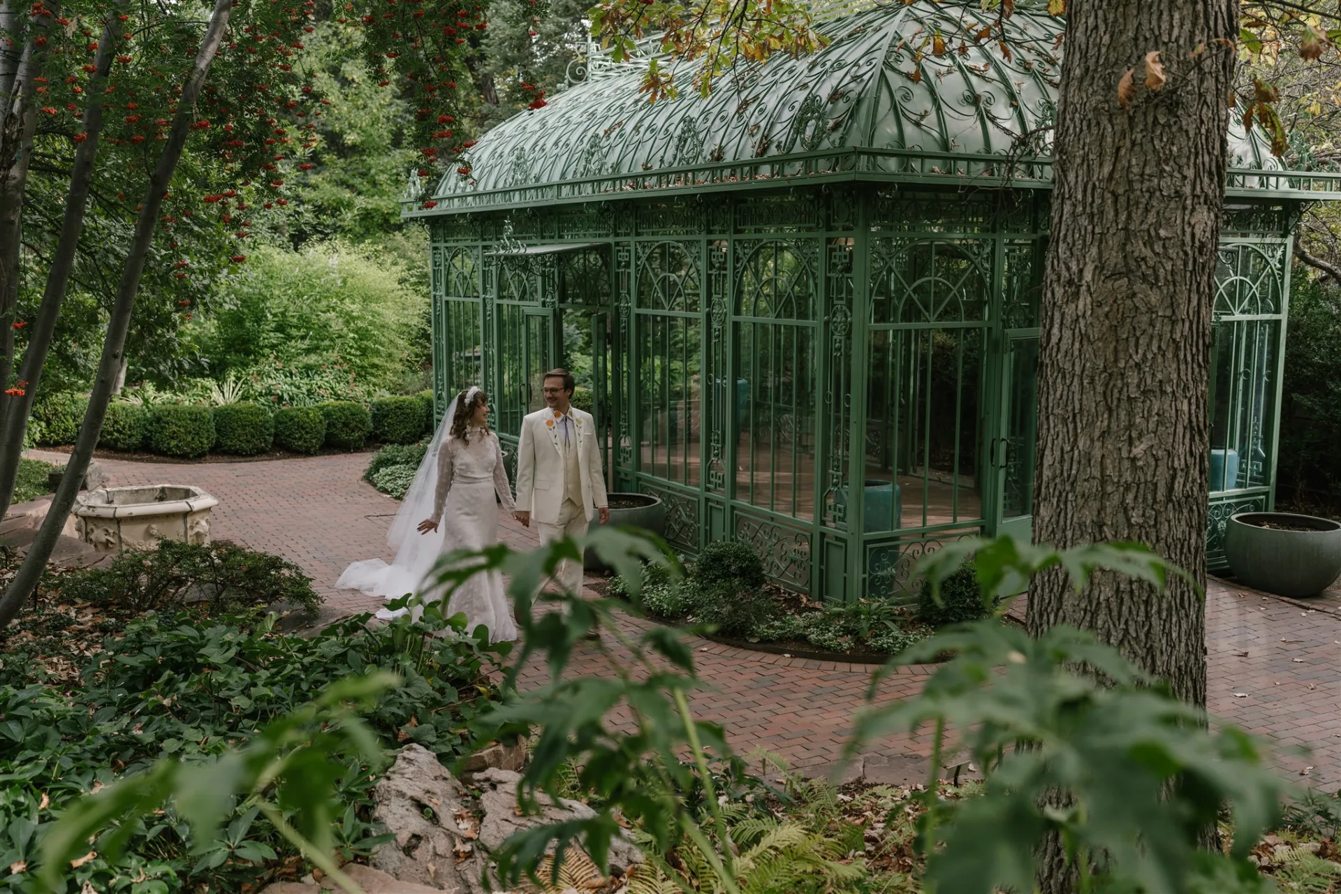 Couples walking through the Denver Botanic Gardens by the Woodland Mosaic